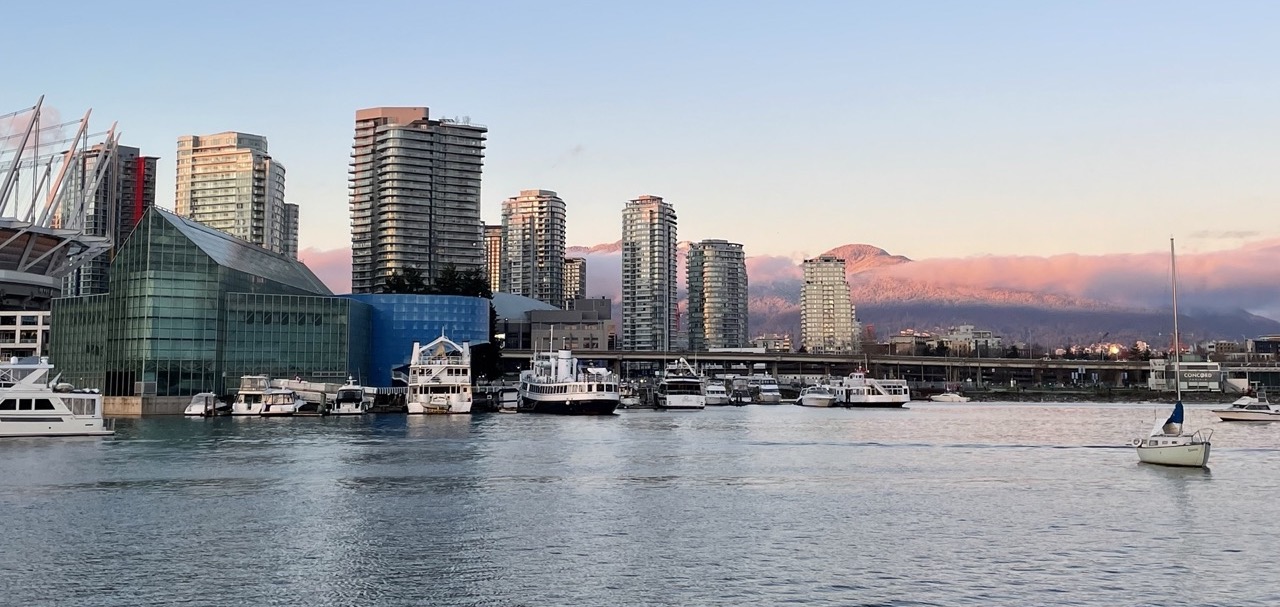 Freshly snow-dusted mountains dressed with sunset clouds on a rare non-rainy Vancouver evening.