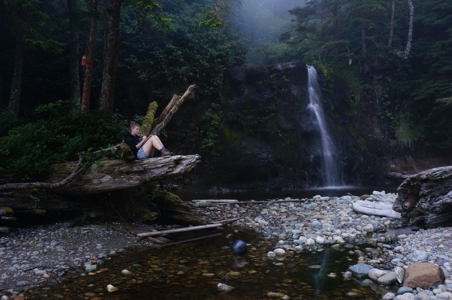 sketching in front of a waterfall